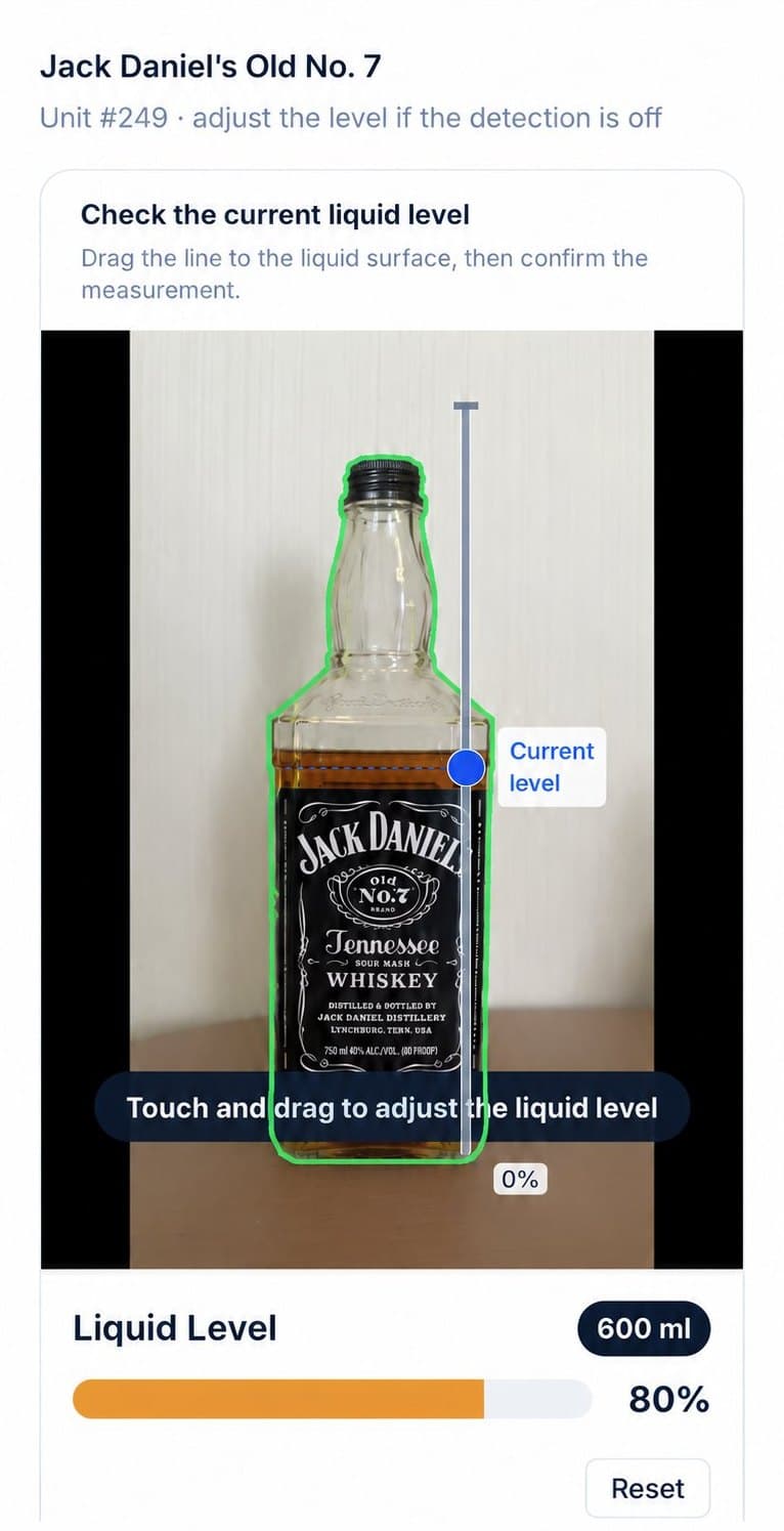 Allie's measuring the liquid level of a bottle from a photo